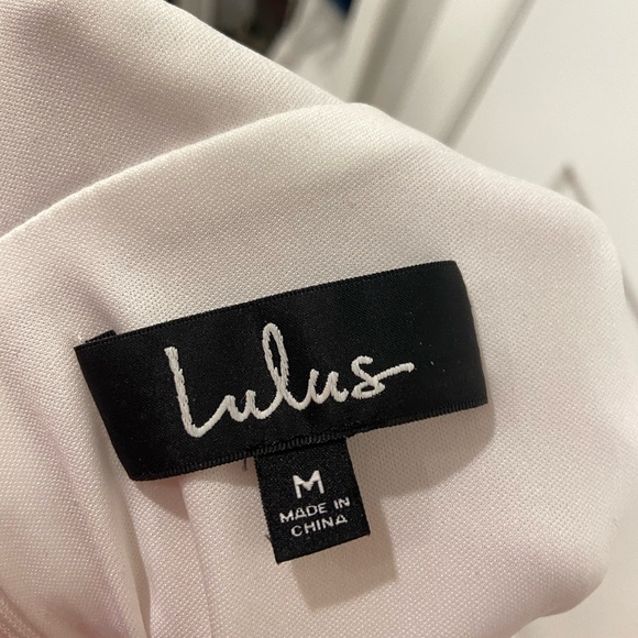 Embroidered white v neck sundress with open back and back bow tie detail - Picture 9 of 10